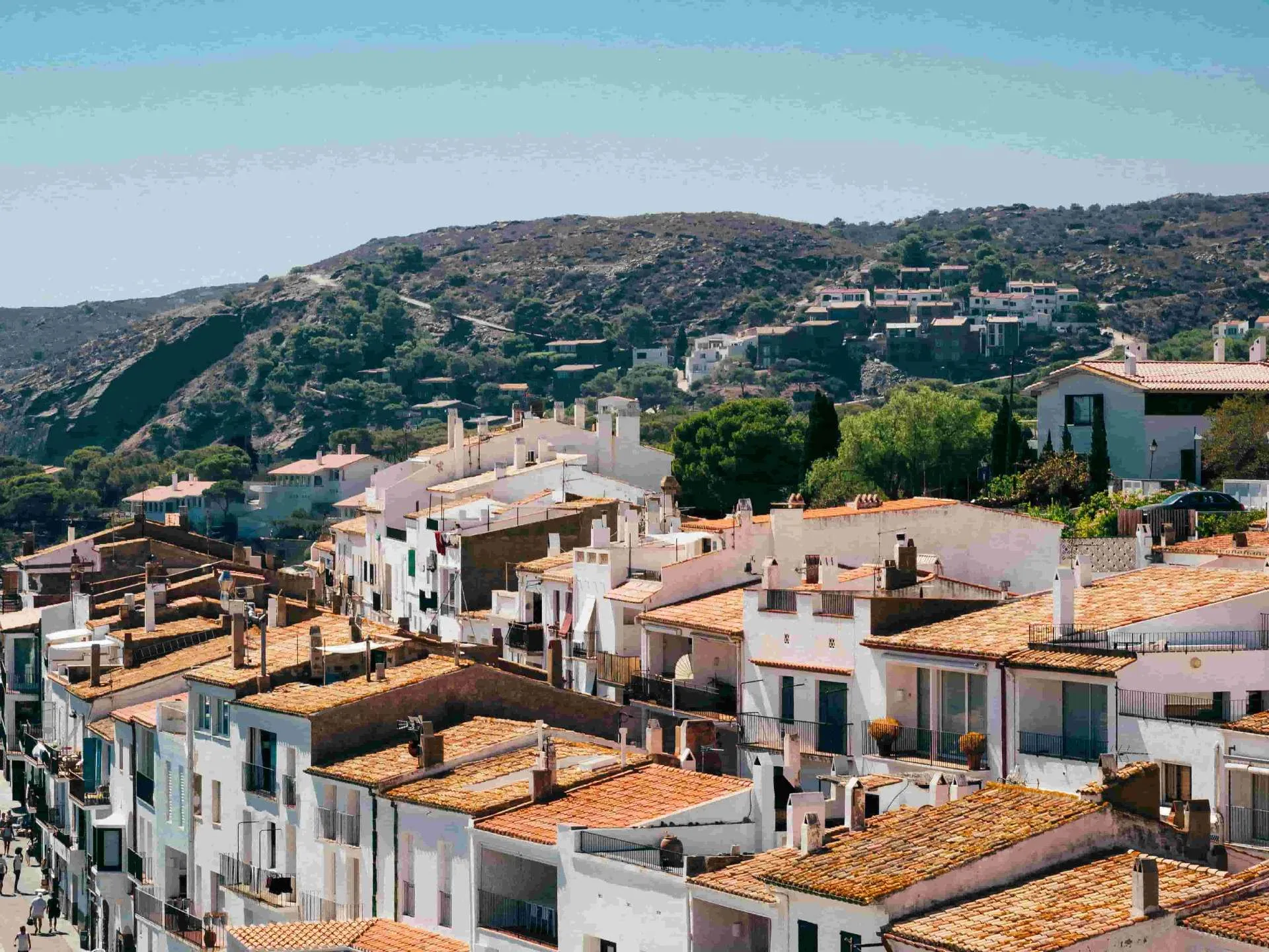 Spanish coastal town with terracotta rooftops – income protection insurance for expats and self-employed