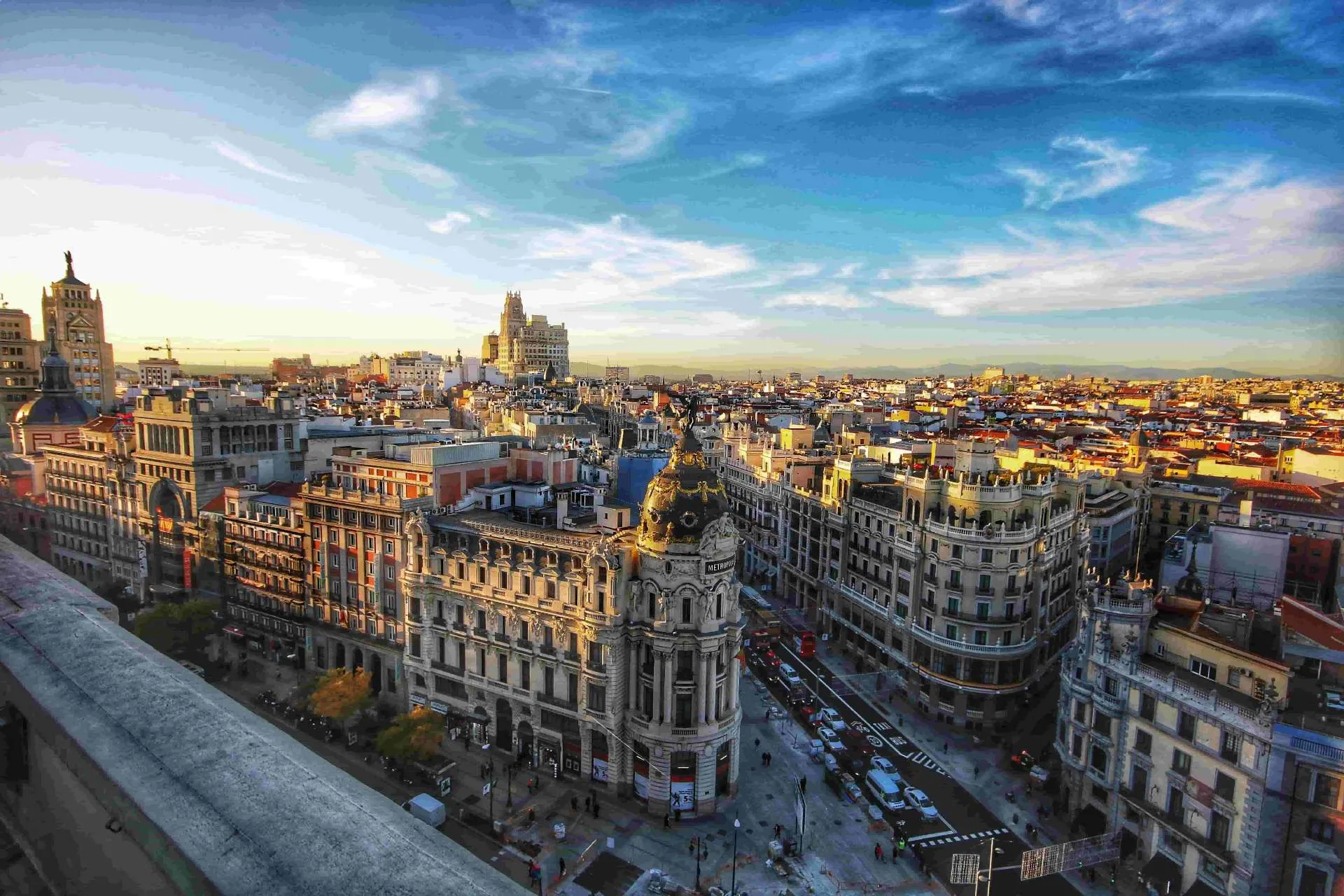 Gran Vía skyline in central Madrid at sunset, popular with expats living and working in Spain