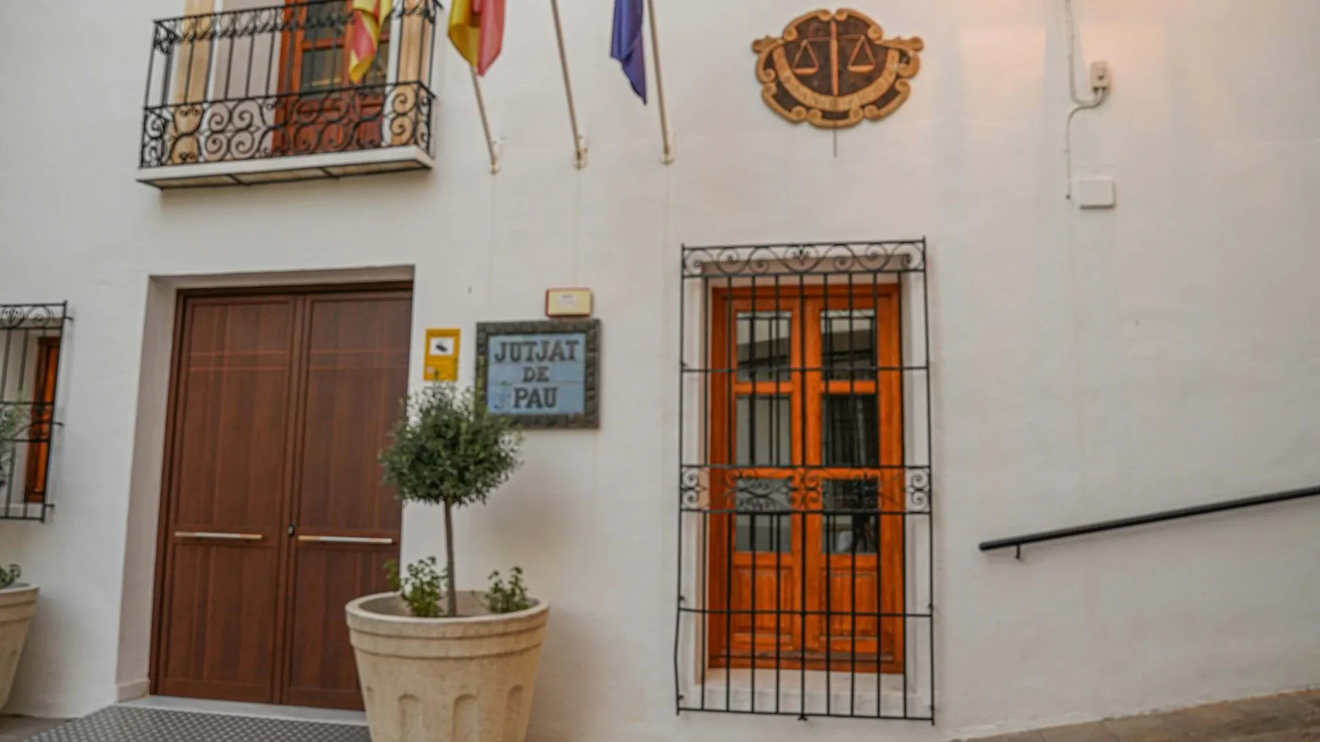 Spain municipal building - Student health insurance for Spanish student visa 2026